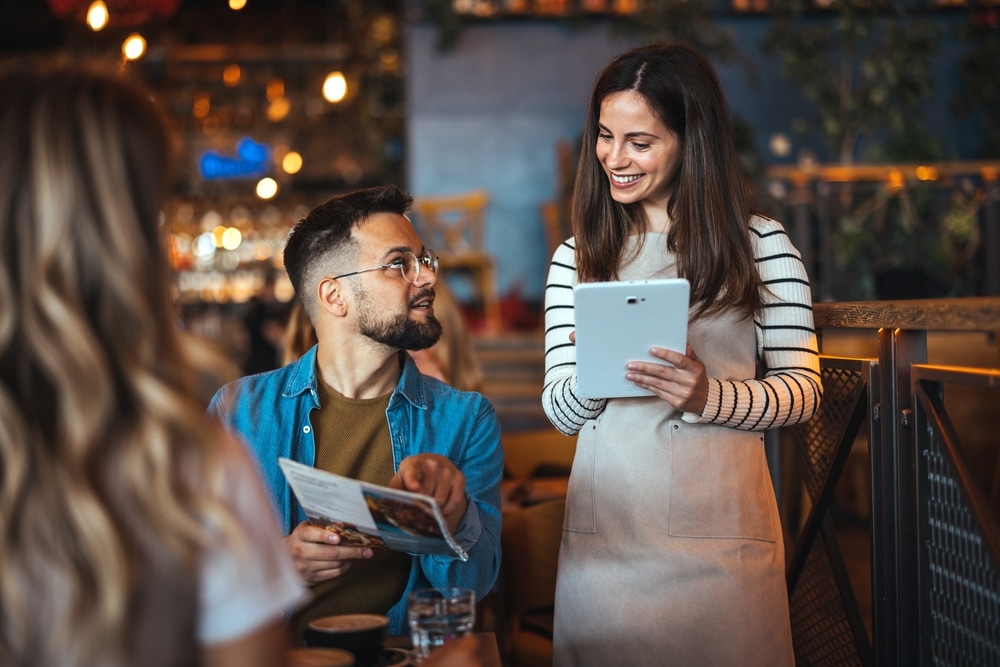 Waitress taking an order at restaurants in Bandon, Oregon