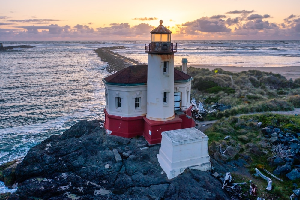 The stunning Coquille River Lighthouse at sunset in Bandon, Oregon.